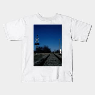 Train crossing in a rural setting Kids T-Shirt